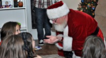 Santa telling the kids a story.