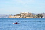 A kayaker on the move around Alcatraz...