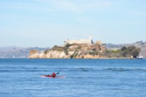 A kayaker on the move around Alcatraz...